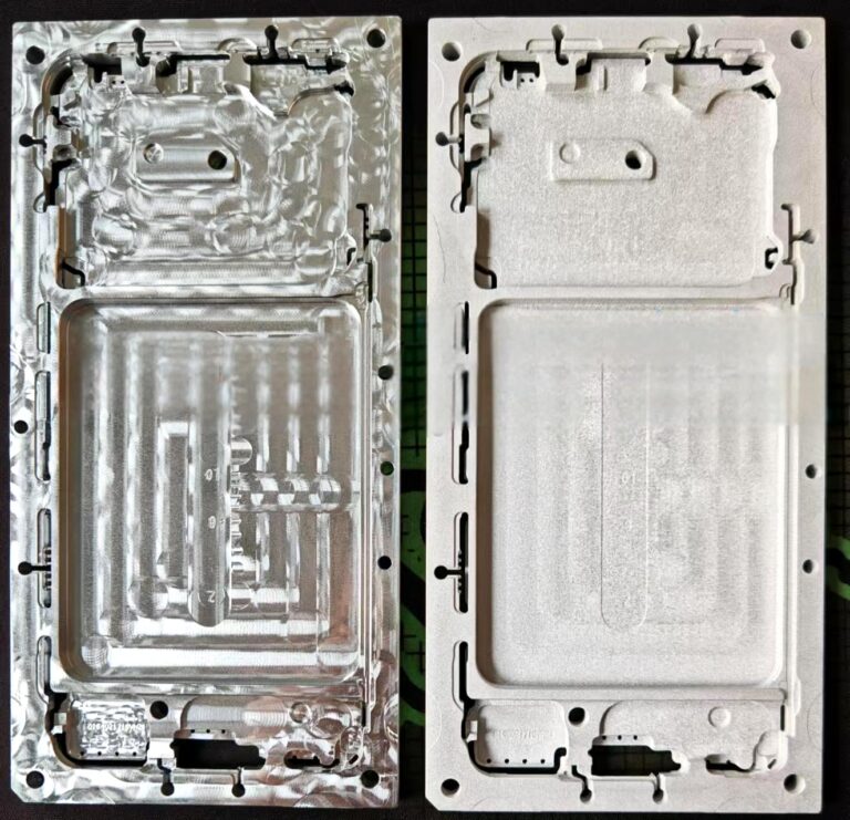 Two metal plates, used in manufacturing or prototyping, are shown side-by-side. One plate shows intricate etched or machined details, while the other is smoother.